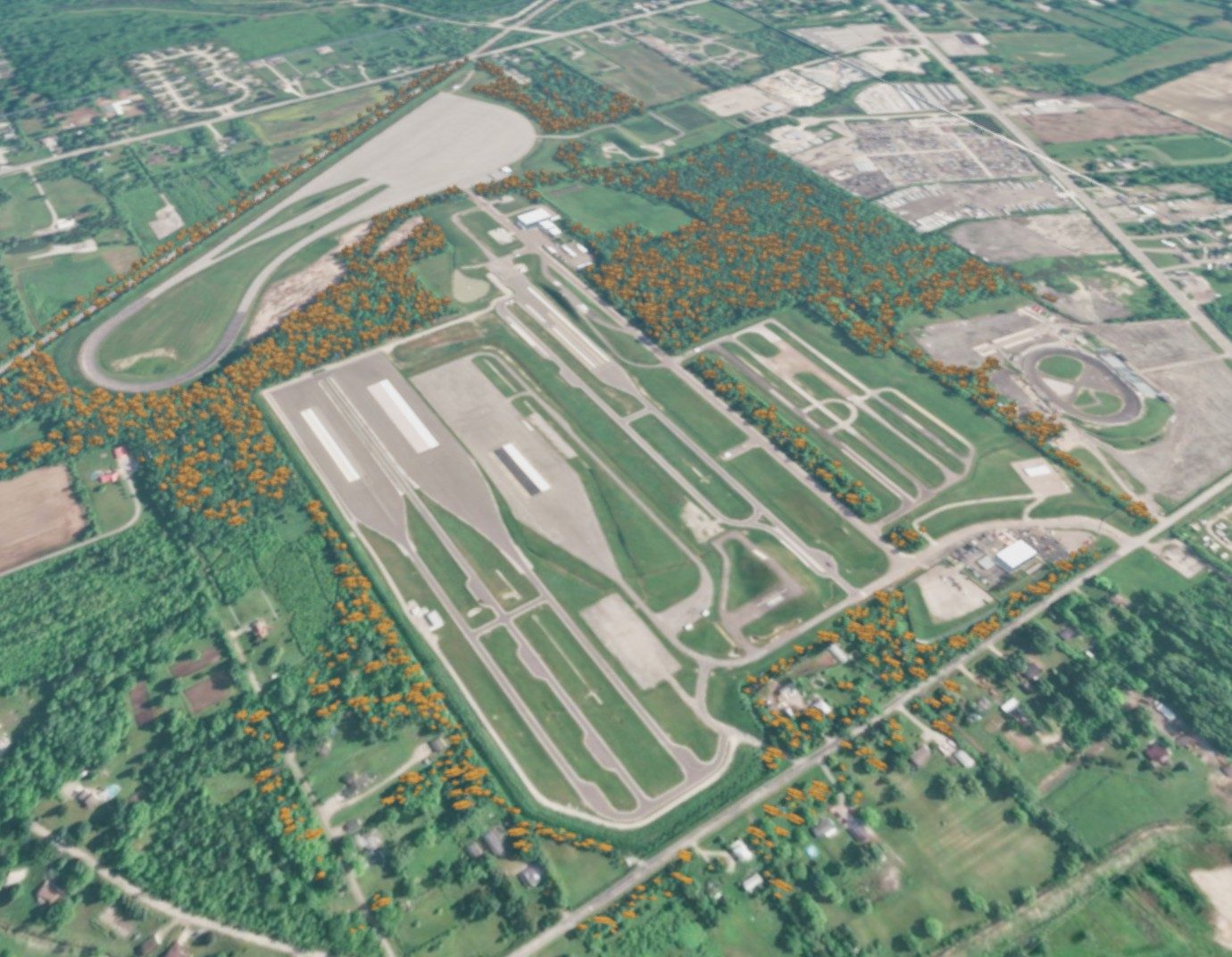 Aerial view of the BeamNG map: a proving ground with painted terrain and trees