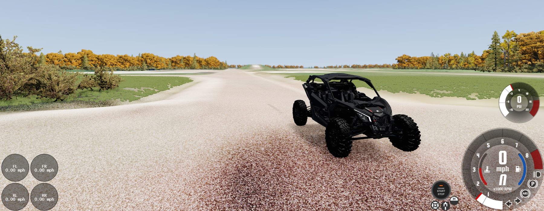 In-game view of the painted terrain, with a buggy on a pale gravel surface, grass and autumn trees